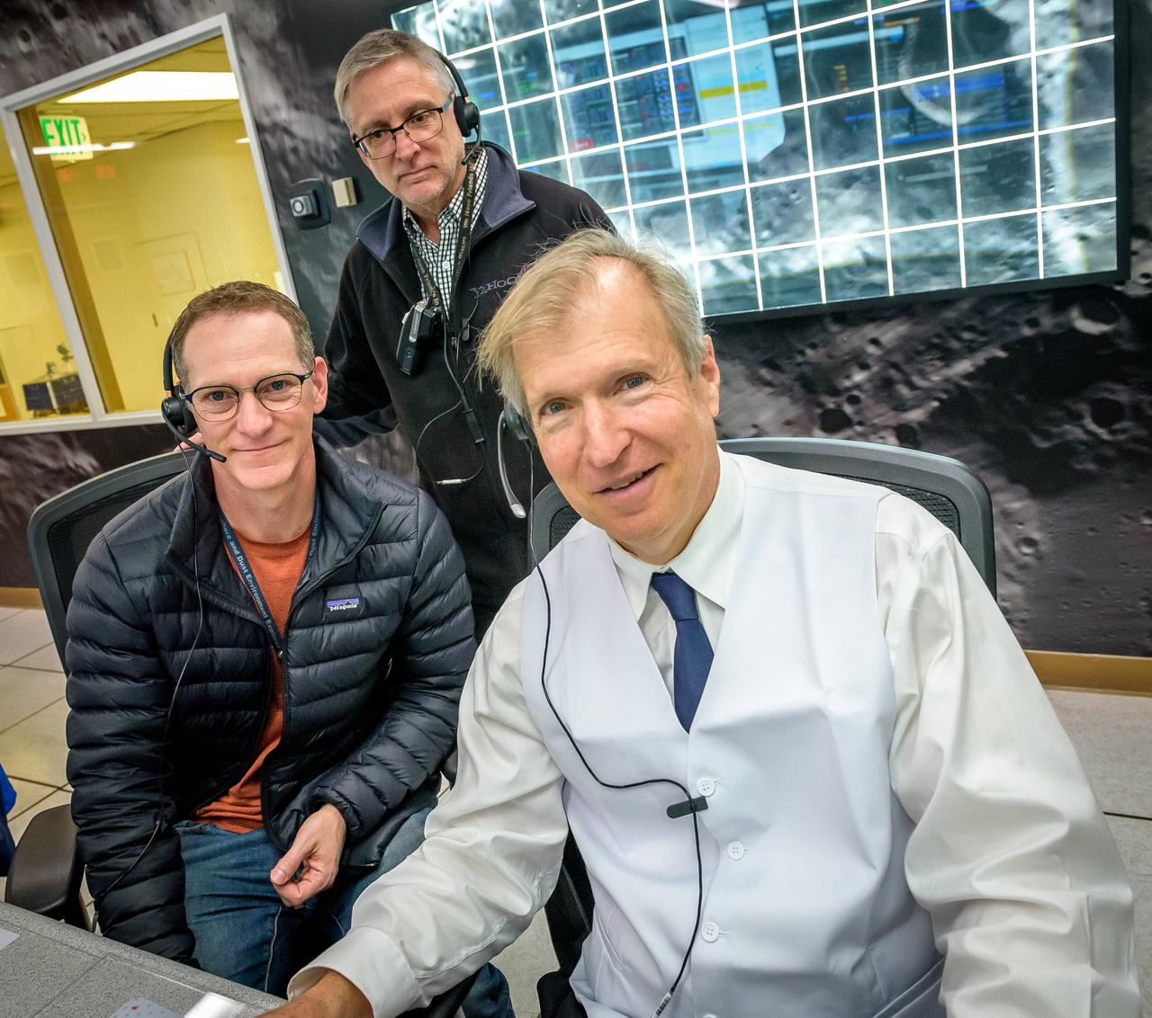 Ryan Vaughan, left, Dean Kontinos, and Jay Trimble, right during the Volatiles Investigating Polar Exploration Rover (VIPER) vehicle operational readiness test in the Multi-Mission Operations Center (MMOC), N240A.