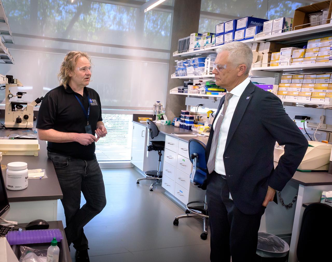 Director of Science Michael Hesse, left, presents an overview of Lunar Explorer Instrument for space biology Applications (LEIA) to Acting Deputy Associate Administrator (DAA) for the Science Mission Directorate (SMD) Mark Clampin in the Bioscience Collaborative Laboratory, N288.