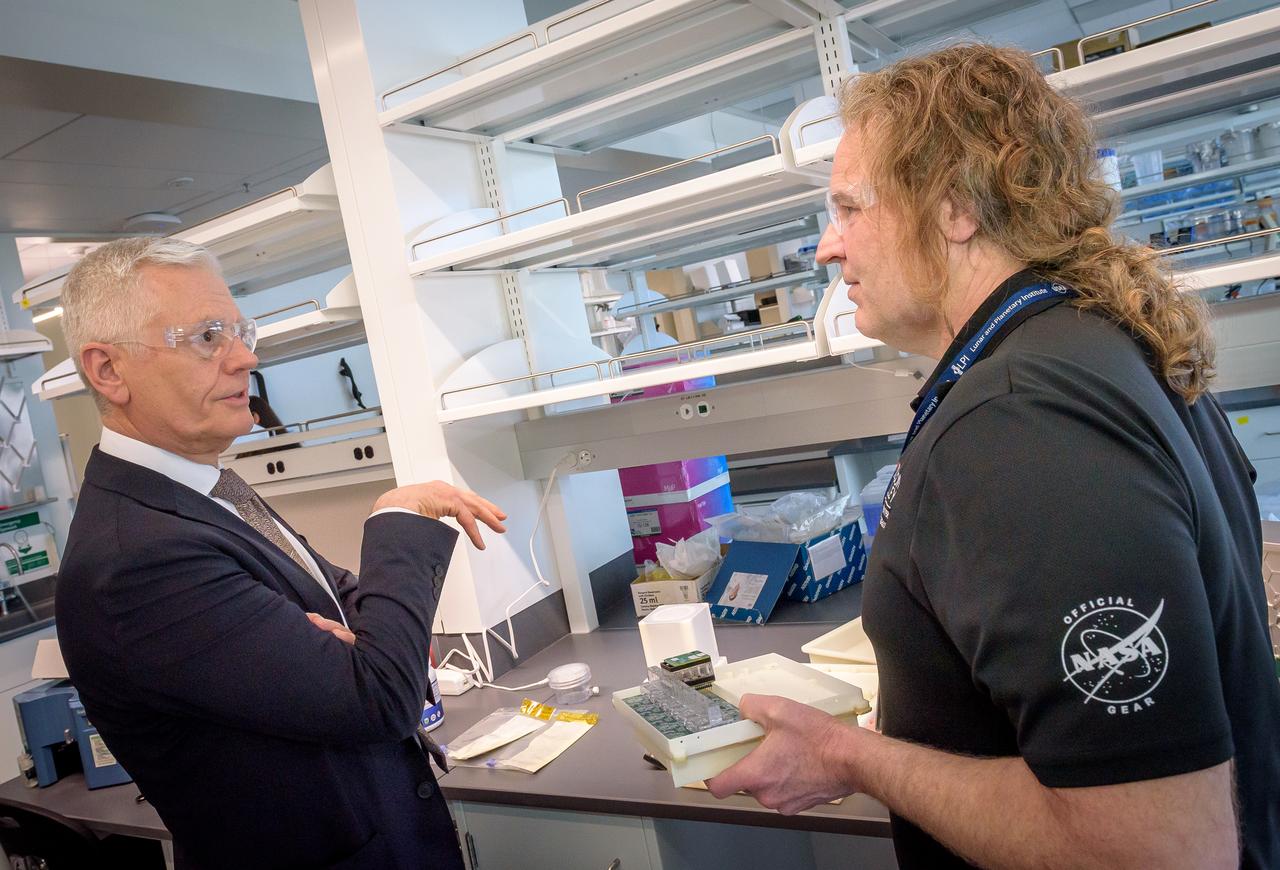 Director of Science Michael Hesse, right, presents an overview of Lunar Explorer Instrument for space biology Applications (LEIA) to Acting Deputy Associate Administrator (DAA) for the Science Mission Directorate (SMD) Mark Clampin in the Bioscience Collaborative Laboratory, N288.