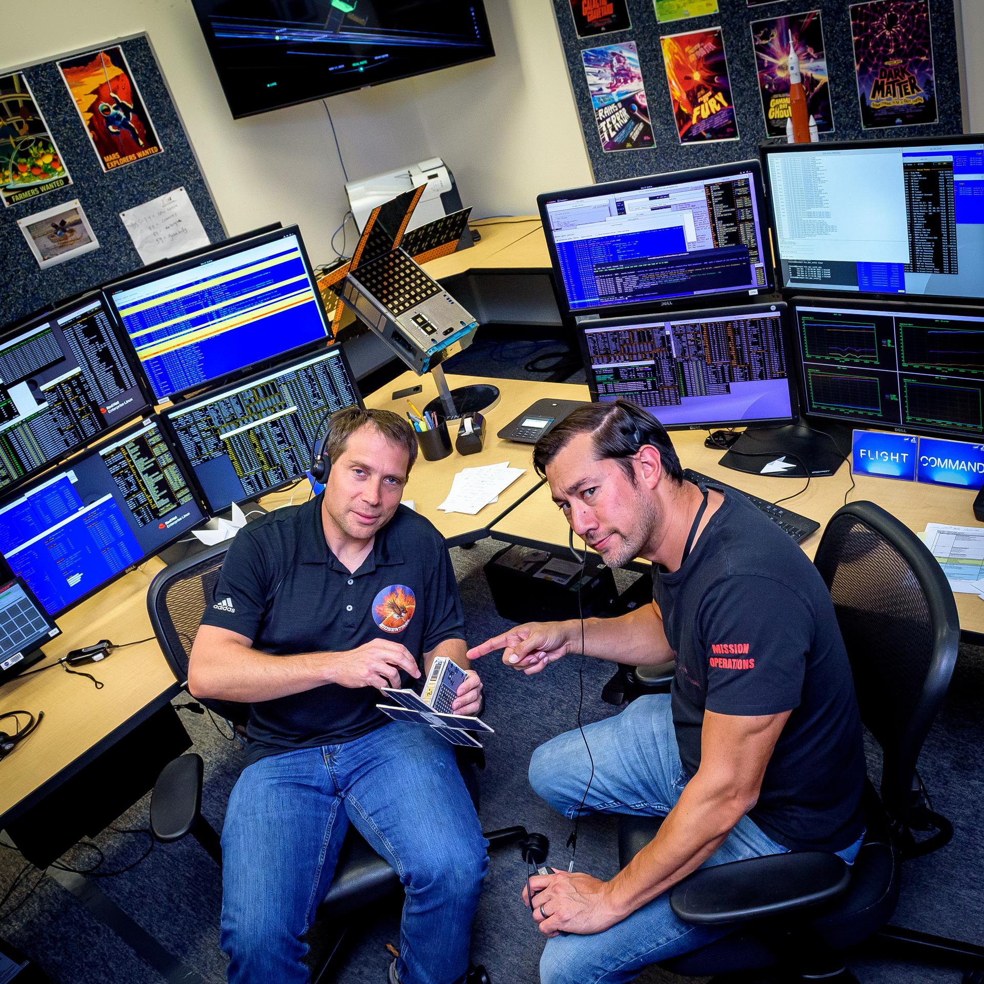 Jesse Fusco, left, and James Milsk at the BioSentinel command console in the Ames Multi-Mission Operations Center (MMOC), N240 Annex, Ceres control room 172, receiving spacecraft telemetry at the 3-year anniversary since launch on Artemis I.
