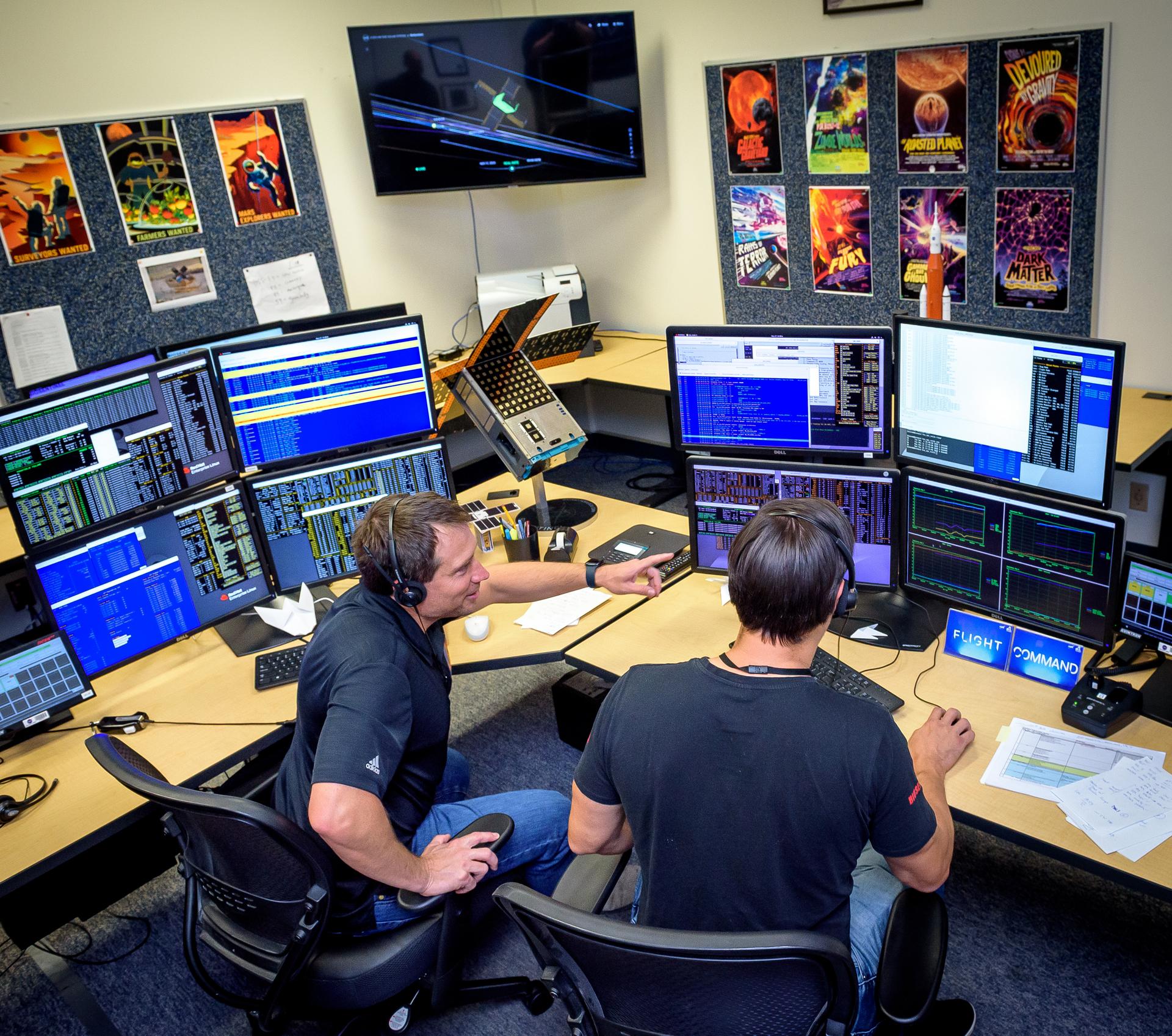 Jesse Fusco, left, and James Milsk at the BioSentinel command console in the Ames Multi-Mission Operations Center (MMOC), N240 Annex, Ceres control room 172, receiving spacecraft telemetry at the 3-year anniversary since launch on Artemis I.