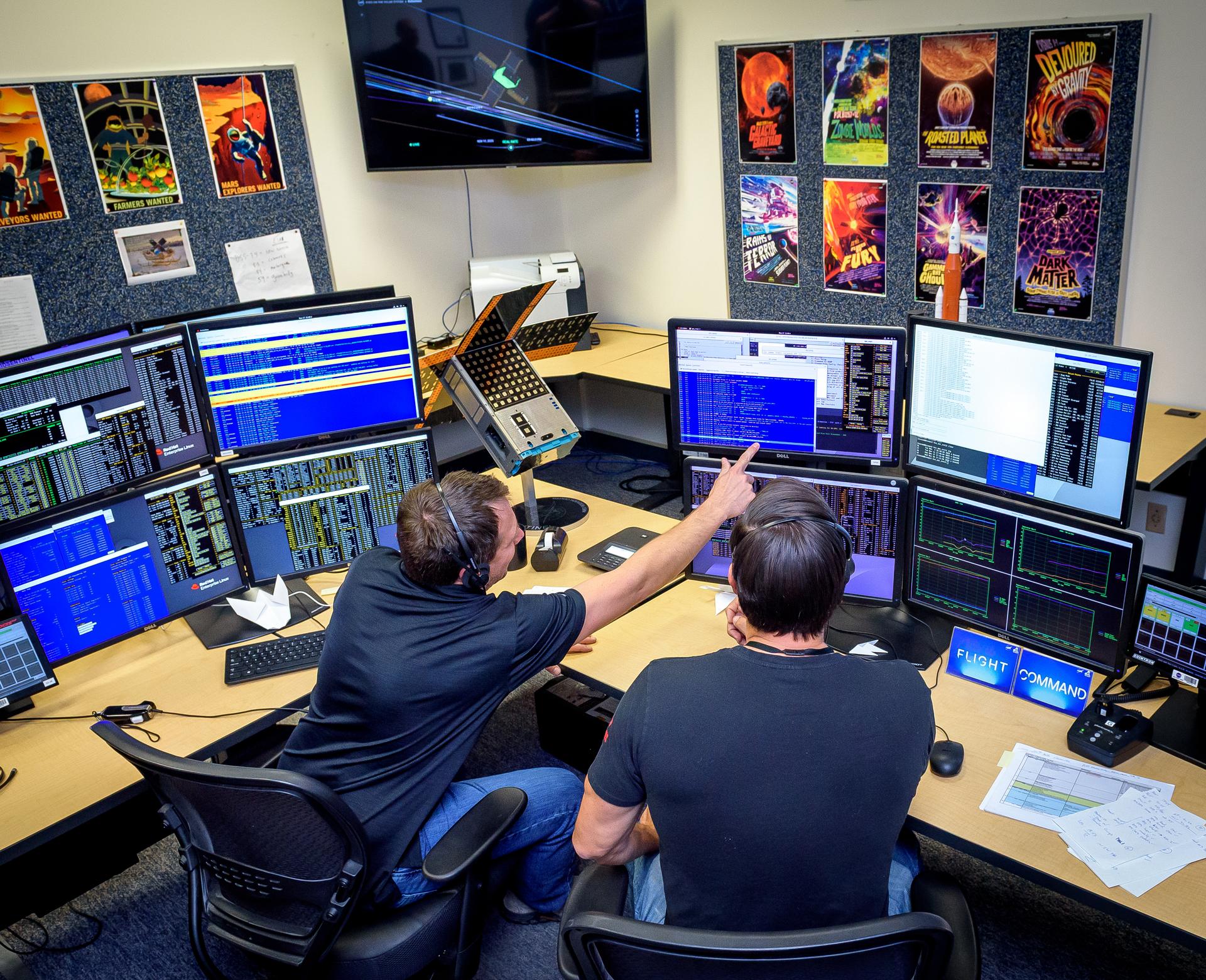 Jesse Fusco, left, and James Milsk at the BioSentinel command console in the Ames Multi-Mission Operations Center (MMOC), N240 Annex, Ceres control room 172, receiving spacecraft telemetry at the 3-year anniversary since launch on Artemis I.