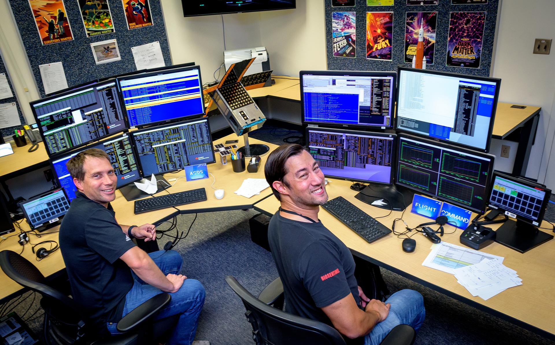 Jesse Fusco, left, and James Milsk at the BioSentinel command console in the Ames Multi-Mission Operations Center (MMOC), N240 Annex, Ceres control room 172, receiving spacecraft telemetry at the 3-year anniversary since launch on Artemis I.