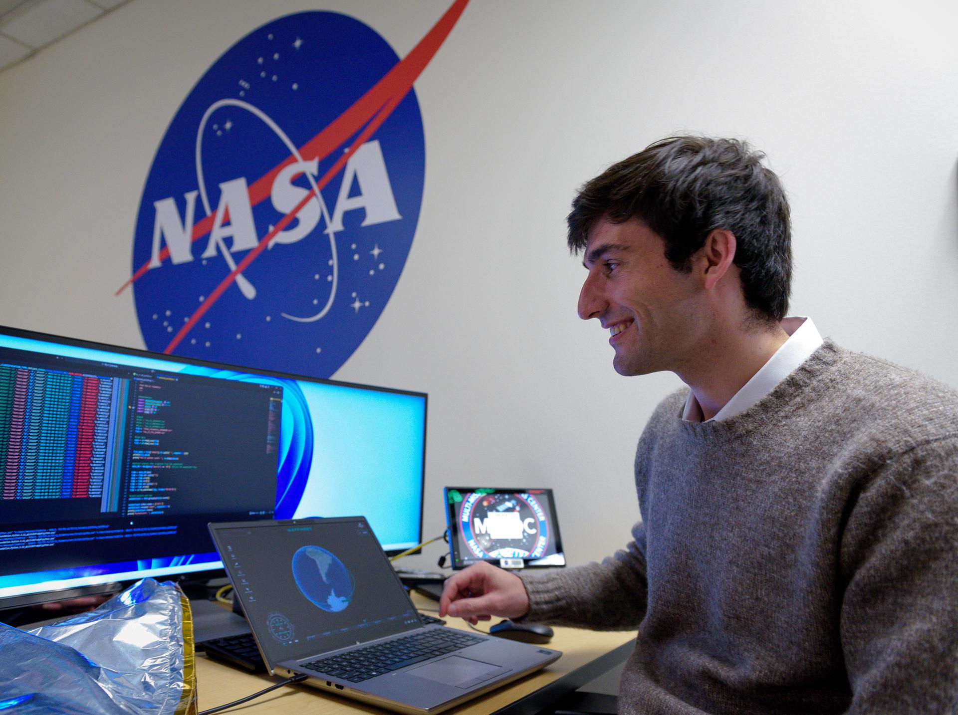 TechEdSat-11 operator Malachi Mooney-Rivkin, in the Ames Multi-Mission Operations Center (MMOC), N240 Annex, Eros control room 162. Malachi monitors the spacecraft's status during the Exo-Brake “parachute” deployment.   The ExoBrake is a drag device that increases the total surface area of the spacecraft to assist with a quicker deorbit. This maneuver is deployed at the end of mission to satisfy NASA's deorbit requirement and prevent space debris. TechEdSat has spent the last several months coordinating with NASA’s Conjunction Assessment Risk Analysis (CARA) team to ensure the spacecraft can safely deploy the ExoBrake without colliding into any other objects.