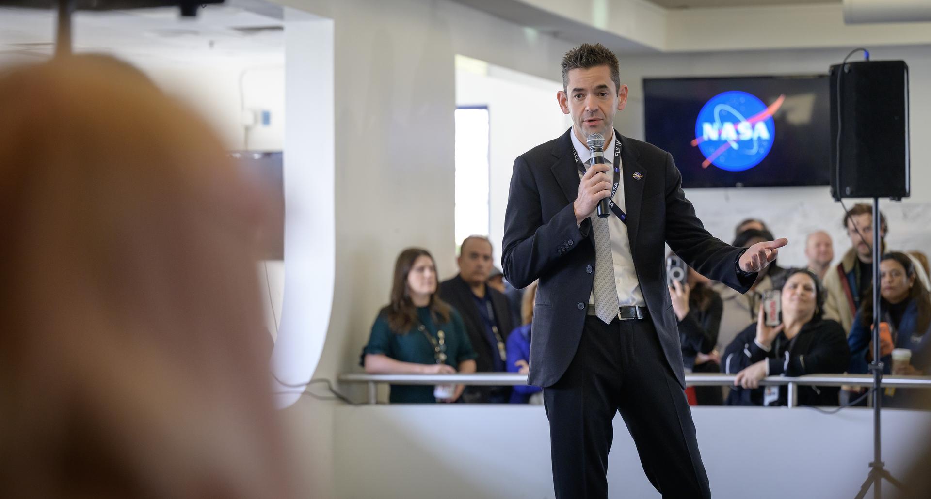 NASA Administrator Jared Isaacman speaks to Ames employees during his coffee and donuts event in MegaBites N235. 