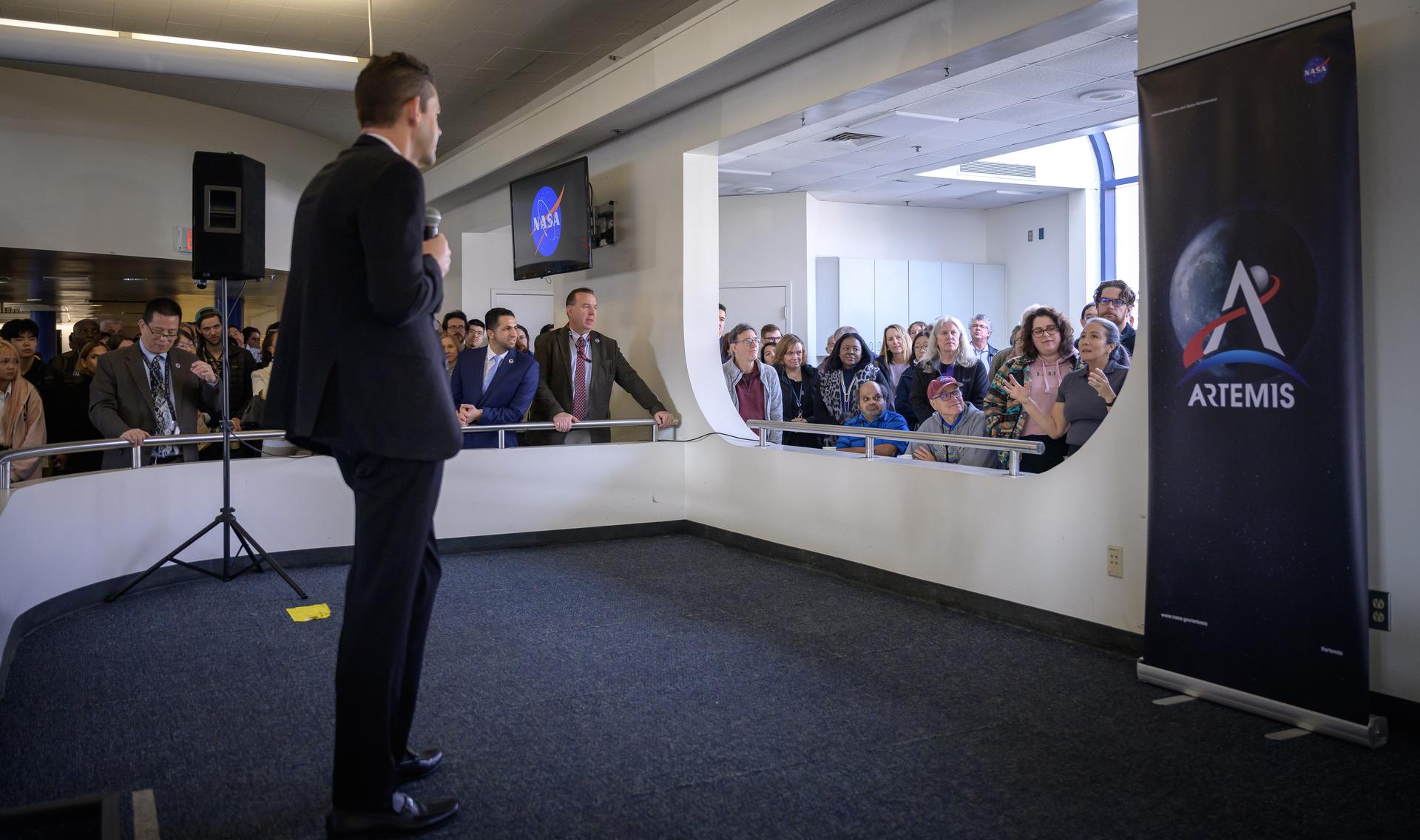 NASA Administrator Jared Isaacman responds to questions from Ames employees during his coffee and donuts event in MegaBites N235.