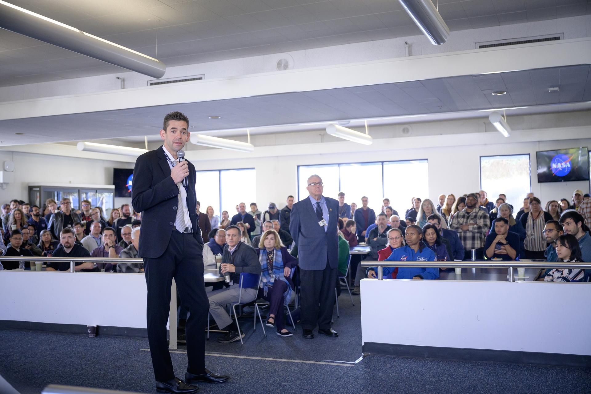 NASA Administrator Jared Isaacman responds to questions from Ames employees during his coffee and donuts event in MegaBites N235.