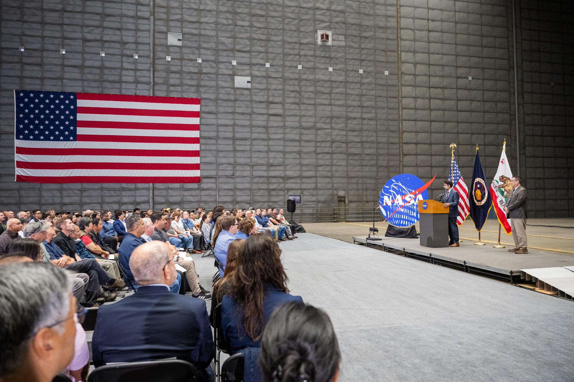 Associate Administrator Amit Kshatriya gives remarks at the NASA Civil Servant Swearing-in Ceremony in the National Full-Scale Aerodynamics Complex (NFAC) 80-by-120-foot test section, N221.