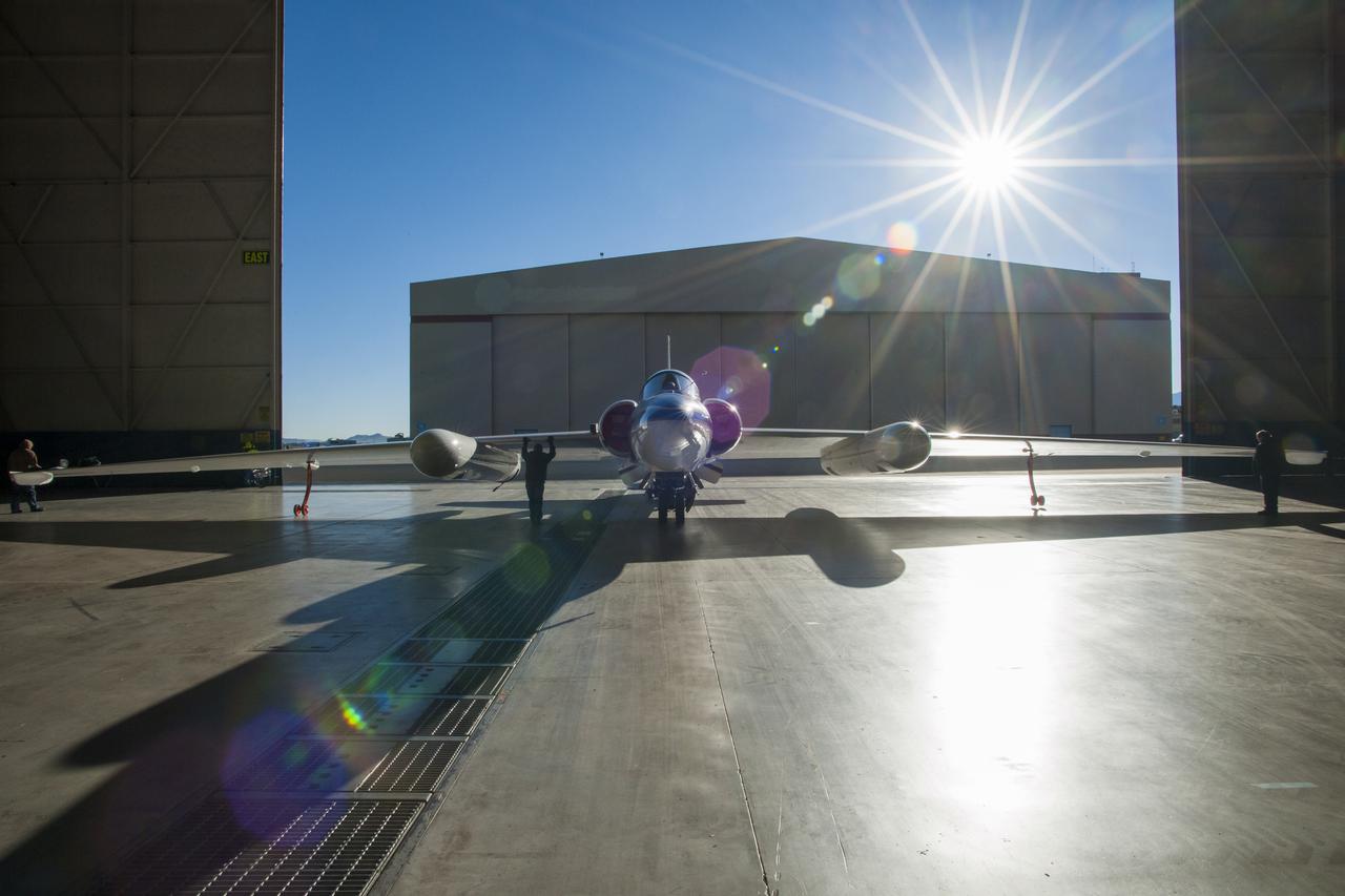 One of two NASA ER-2s (civilian U2-Rs) being backed out of the hangar at Building 703 in Palmdale. Capable of long duration flights at very high altitudes, the ER-2s have wing pods to accommodate science experiments and sensors, as well as a large volume bay behind the pilot. NASA first flew a U-2 for science—a first generation aircraft—in 1972.