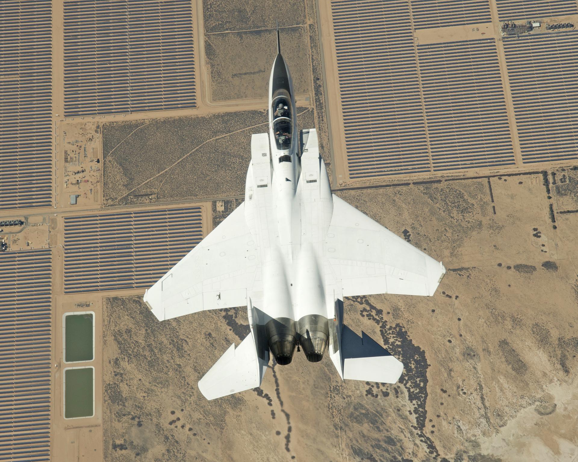 The F-15B is seen here flying over the mirror farm, AKA the Abengoa Mojave Solar Project.