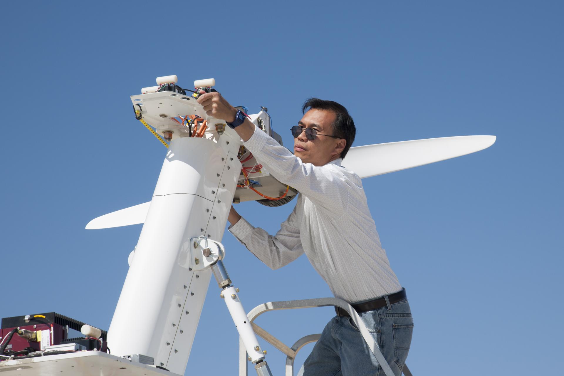 Yohan Lin, Airvolt integration lead, prepares the electric propulsion test stand.