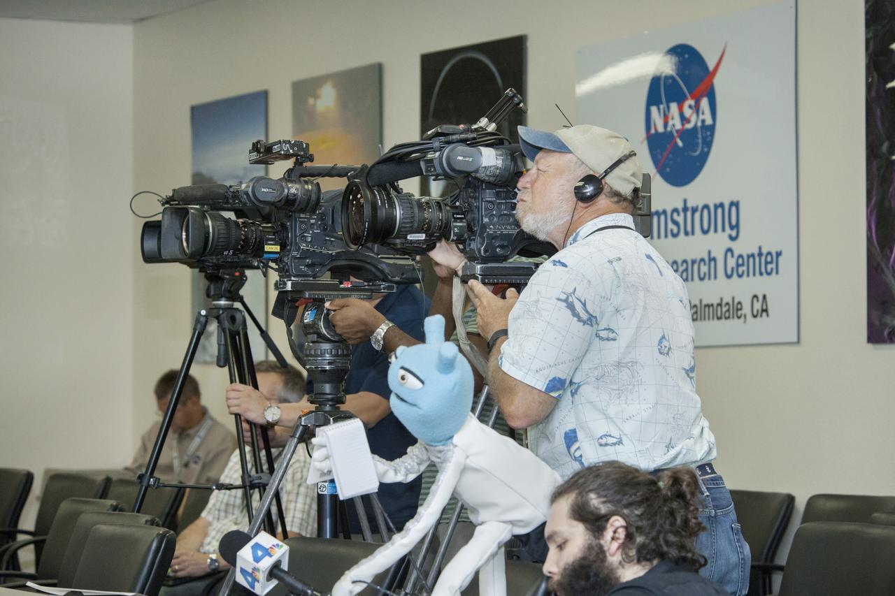 Media, including a puppeteer, participate in a press conference for the ATom airborne science mission which is studying the atmosphere.