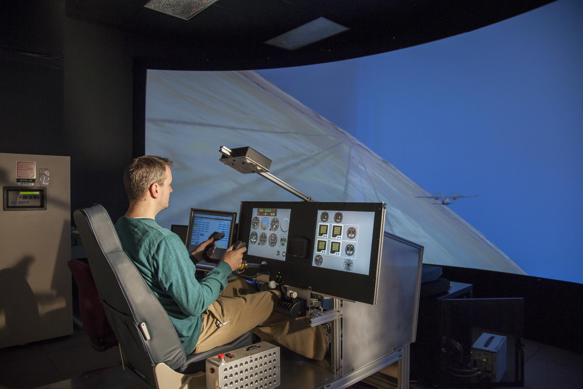 X-57 principal investigator Sean Clarke flies the X-57 simulator at NASA’s Armstrong Flight Research Center, examining ideal maneuvers and reaction times for flight.