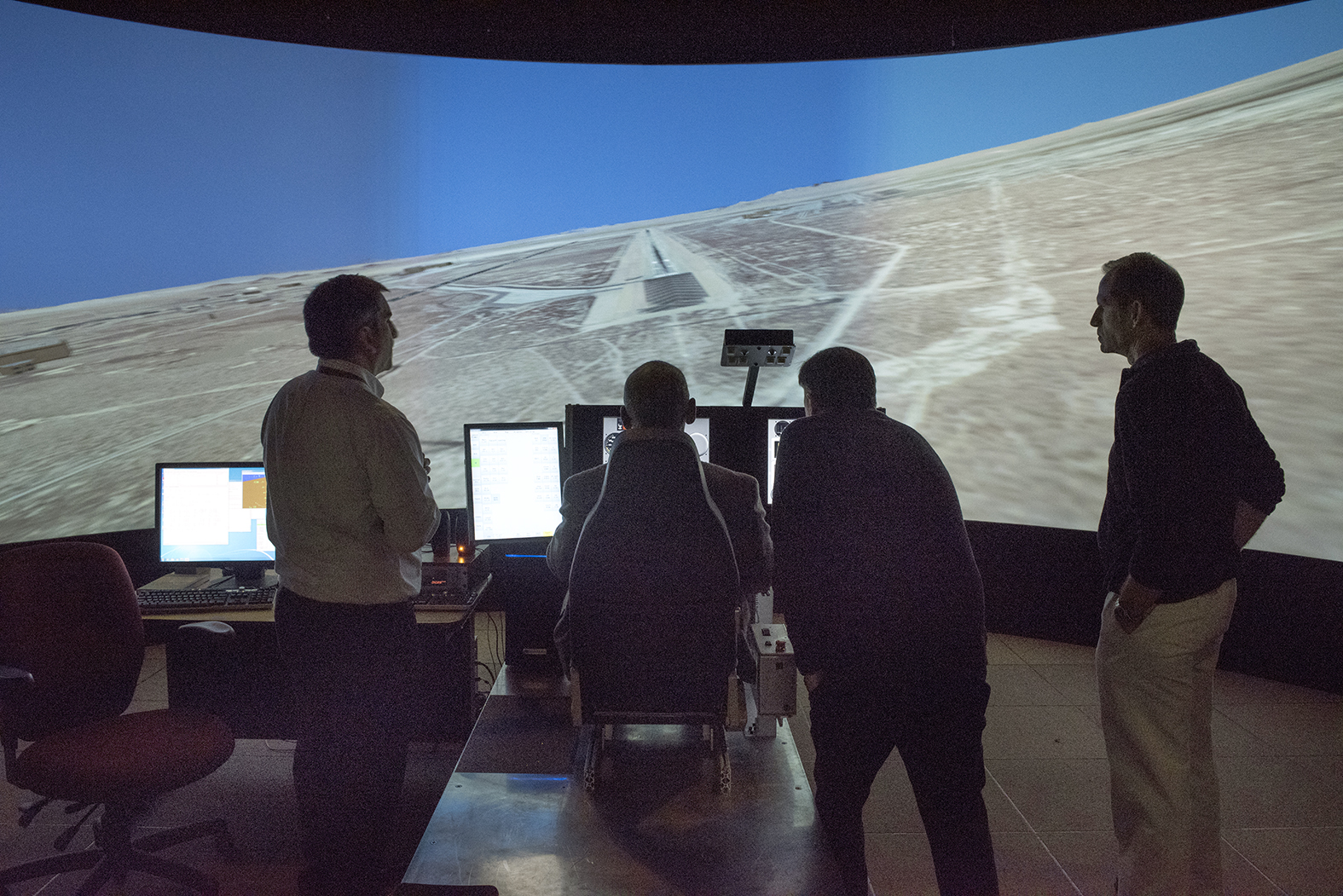 NASA Administrator Charlie Bolden, a former pilot and astronaut who flew on four shuttle missions, appeared natural at the controls of the X-57 simulator cockpit, and flew a pair of simulations where he landed on the Edwards Air Force Base runway.