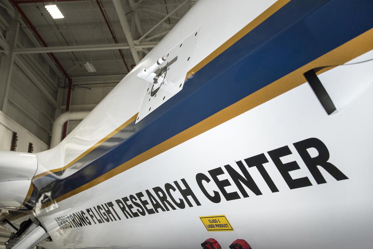 The TAMDAR Edge probe seen in the middle of the NASA Armstrong Ikhana is flying on a large remotely piloted aircraft for the first time.