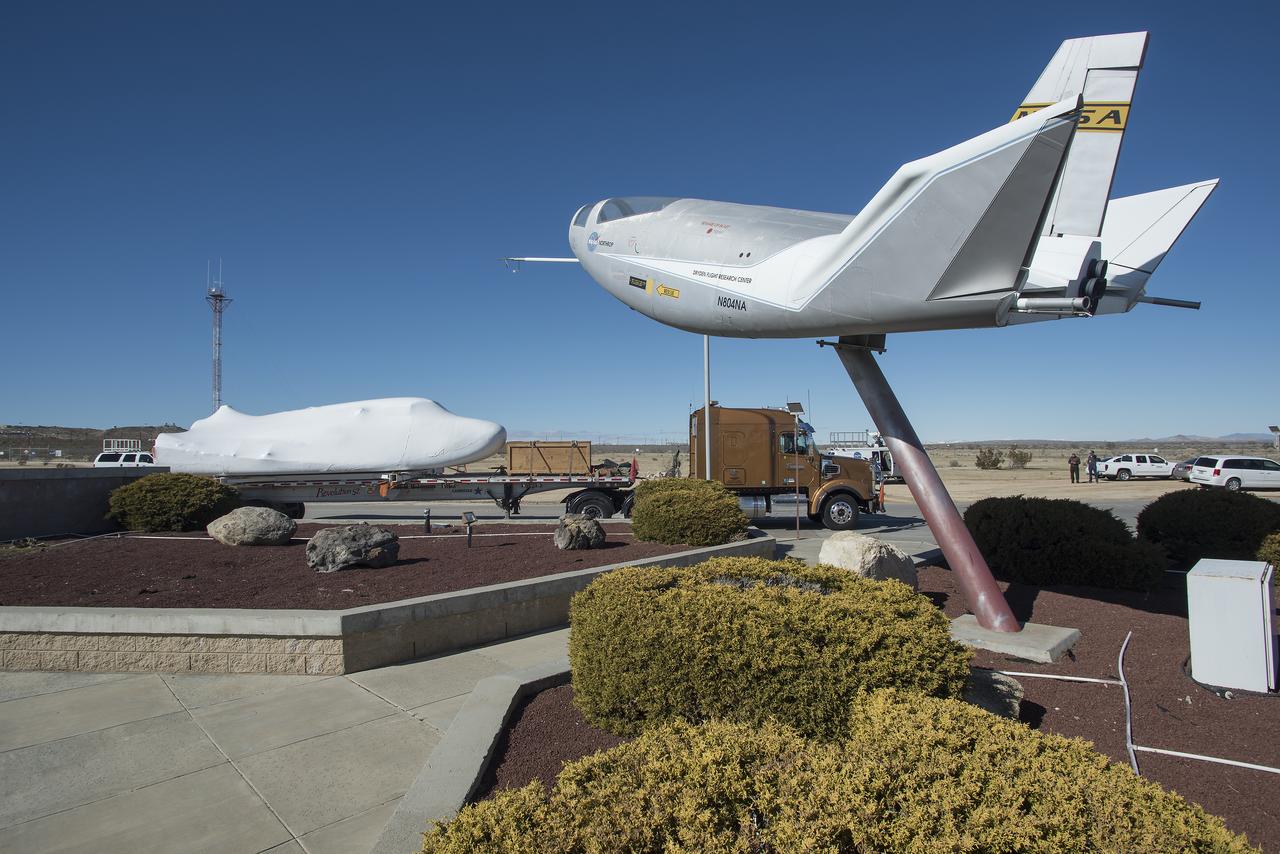 Sierra Nevada Corporation’s Dream Chaser spacecraft arrives by truck at NASA’s Armstrong Flight Research Center in California, located on Edwards Air Force Base. The spacecraft will undergo several months of testing in preparation for its approach and landing flight on the base’s 22L runway. The test series is part of a developmental space act agreement SNC has with NASA’s Commercial Crew Program and will help SNC validate aerodynamic properties, flight software and control system performance. The Dream Chaser is also being prepared to deliver cargo to the International Space Station under NASA’s Commercial Resupply Services 2 contract beginning in 2019. The cargo Dream Chaser will fly at least six delivery missions to and from the space station by 2024.