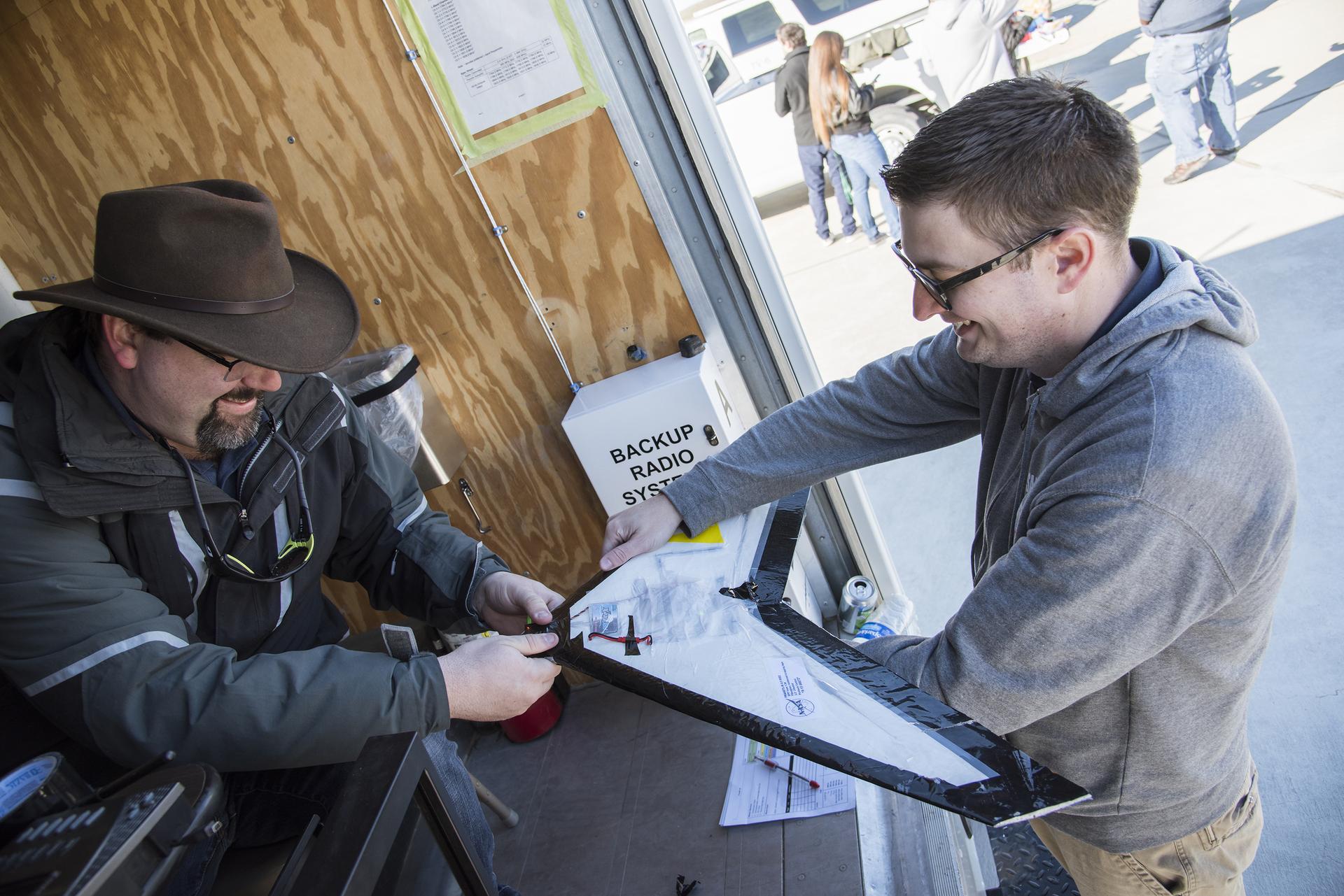 Dave Berger, right, and John Bodylski prepare the Prandtl-M for a test flight.