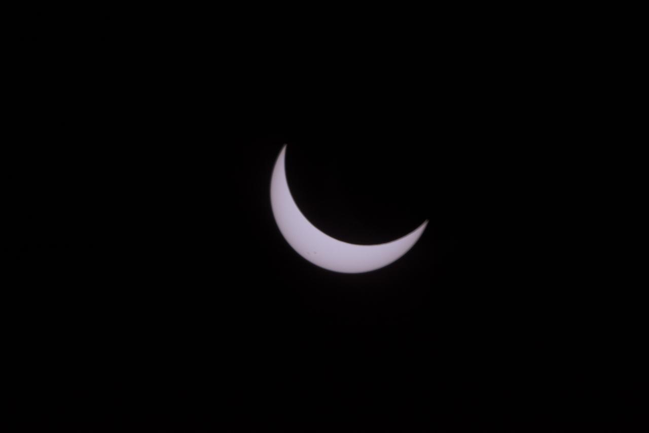 The Moon is seen passing in front of the Sun during a total solar eclipse on Monday, August 21, 2017 from onboard a NASA Gulfstream III aircraft flying 25,000 feet above the Oregon coast. A total solar eclipse swept across a narrow portion of the contiguous United States from Lincoln Beach, Oregon to Charleston, South Carolina. A partial solar eclipse was visible across the entire North American continent along with parts of South America, Africa, and Europe.  Photo Credit: (NASA/Carla Thomas)