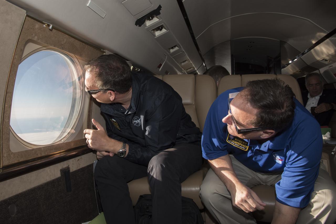 Robert Lightfoot, acting NASA administrator and Thomas Zurbuchen NASA AA for the science mission directorate view a partial eclipse solar eclipse Monday, August 21, 2017, from onboard a NASA Armstrong Flight Research Center’s Gulfstream III 35,000 feet above the Oregon Coast. A total solar eclipse swept across a narrow portion of the contiguous United States from Lincoln Beach, Oregon to Charleston, South Carolina. Photo Credit: (NASA/Carla Thomas)
