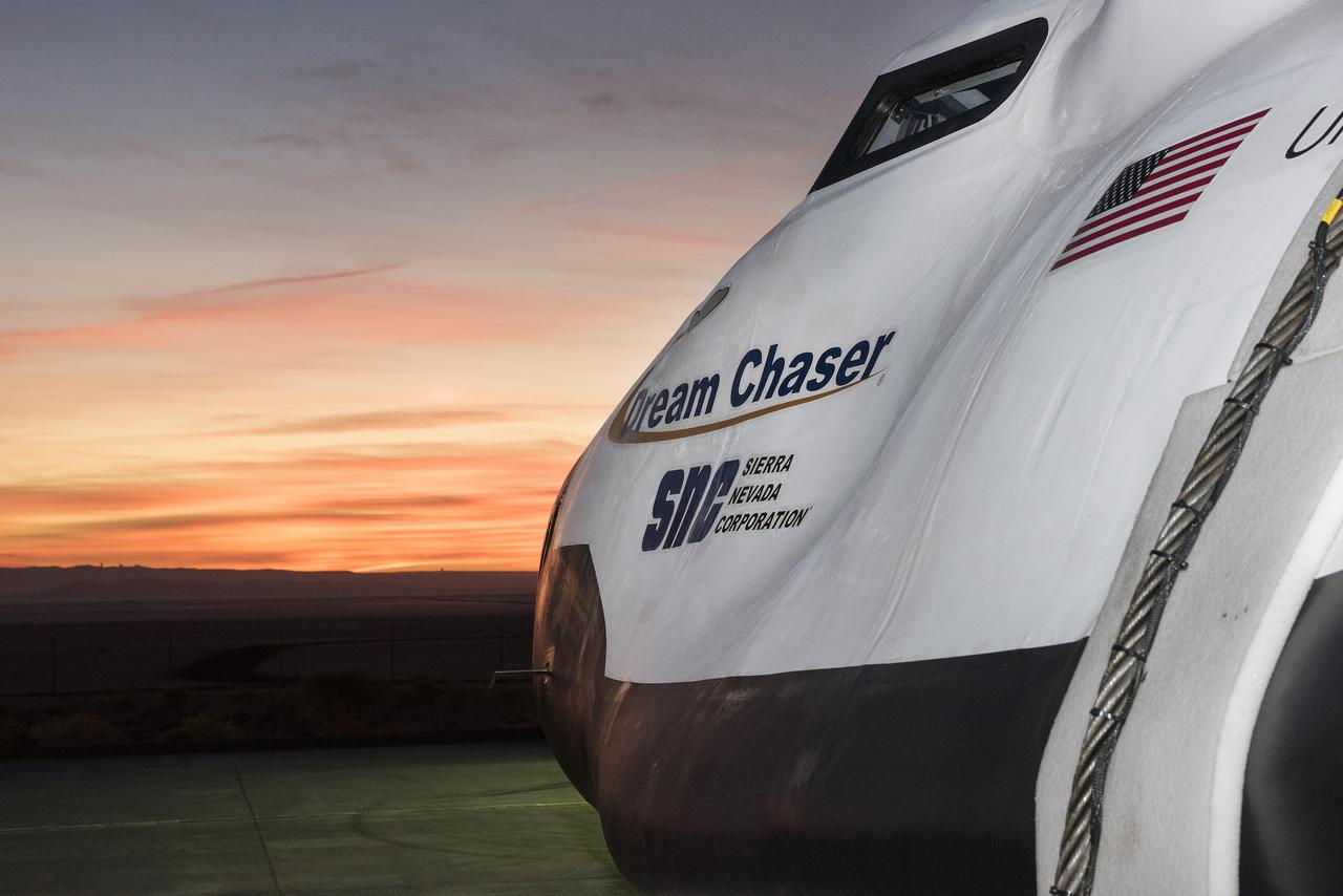 Sierra Nevada Corp’s Dream Chaser facing sunrise over Rogers Dry Lake by NASA Armstrong Flight Research Center in California where it was being prepared for a successful approach and landing test Nov. 11, 2017.