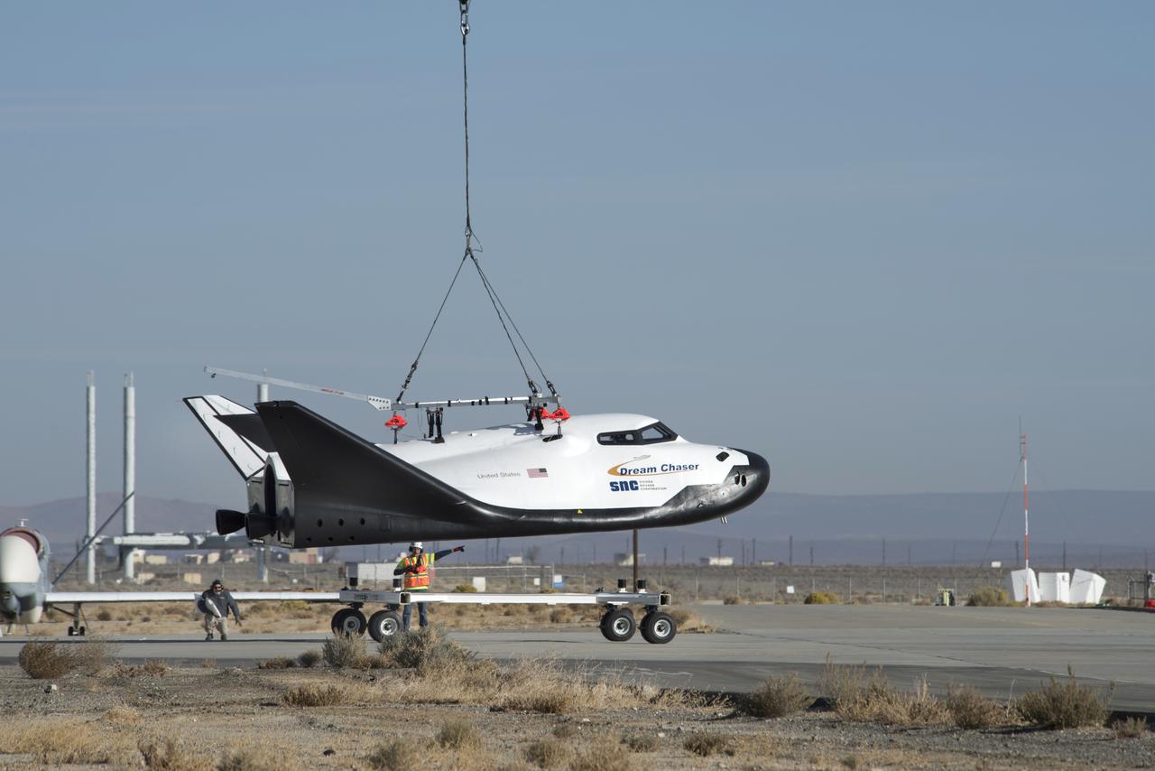 Sierra Nevada Corp’s Dream Chaser was lifted by helicopter from the ramp at NASA’s Armstrong Flight Research Center in Edwards, California, before its successful approach and landing flight test on Nov. 11, 2017.