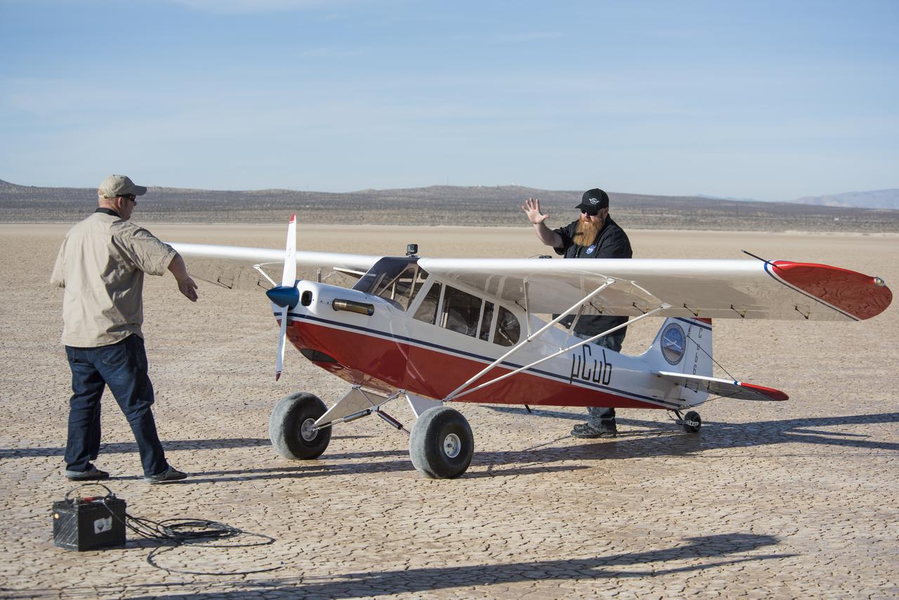 Crew members of the Subscale Research Lab at NASA’s Armstrong Flight Research Center in California perform a series of preflight system checks of the MicroCub to ensure the aircraft is ready for its maiden flight. 