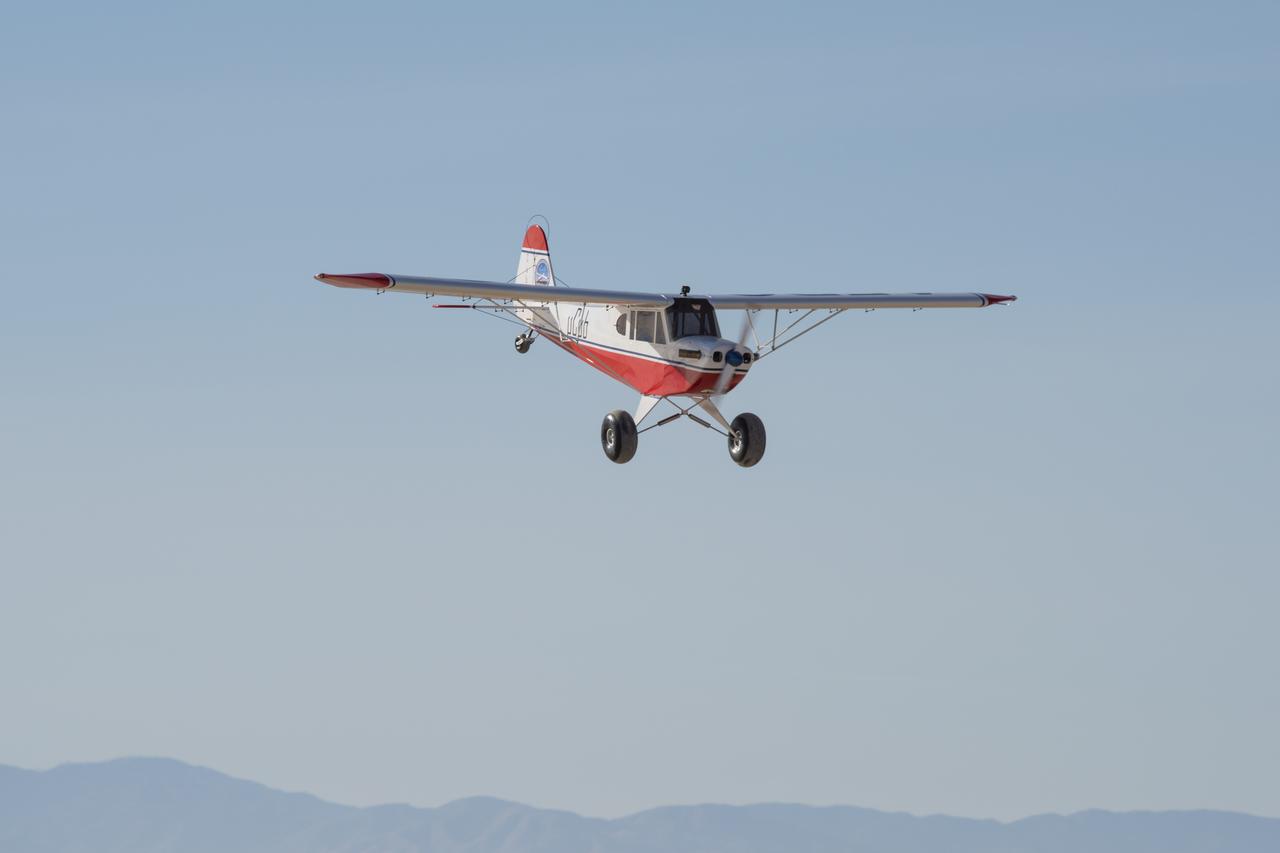 The MicroCub, a modified a Bill Hempel 60-percent-scale super cub, approaches for a landing at NASA's Armstrong Flight Research Center. This was the first flight of the MicroCub in which the crew validated the airworthiness of the aircraft.