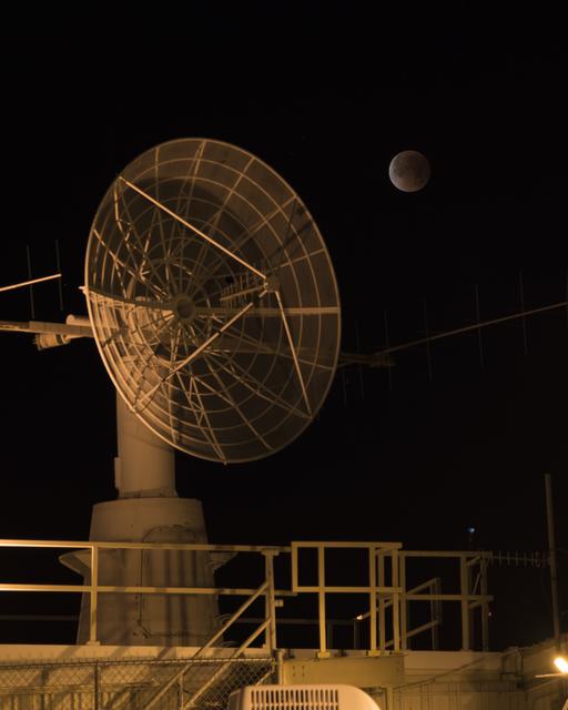 NASA image: NASA Armstrong Flight Research Center's communications facility with radar dish and the eclipsed moon overhead during Jan. 31 Super Blue Blood Moon.