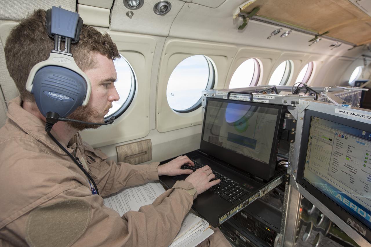 Radar operator Alexander Winteer monitors incoming wind data from the  DopplerScatt radar instrument during a science flight off the California Coast on March 5, 2018.