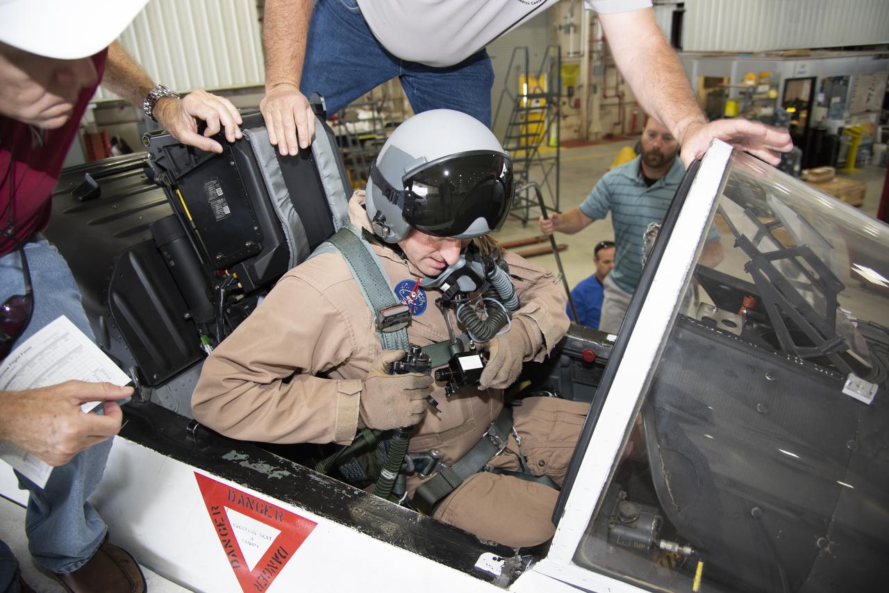 NASA pilot Jim Less sits in the cockpit of a NASA F/A-18 aircraft in preparation for flight tests that will be used to understand the physiological impacts that high-performance aircraft have on pilots. 