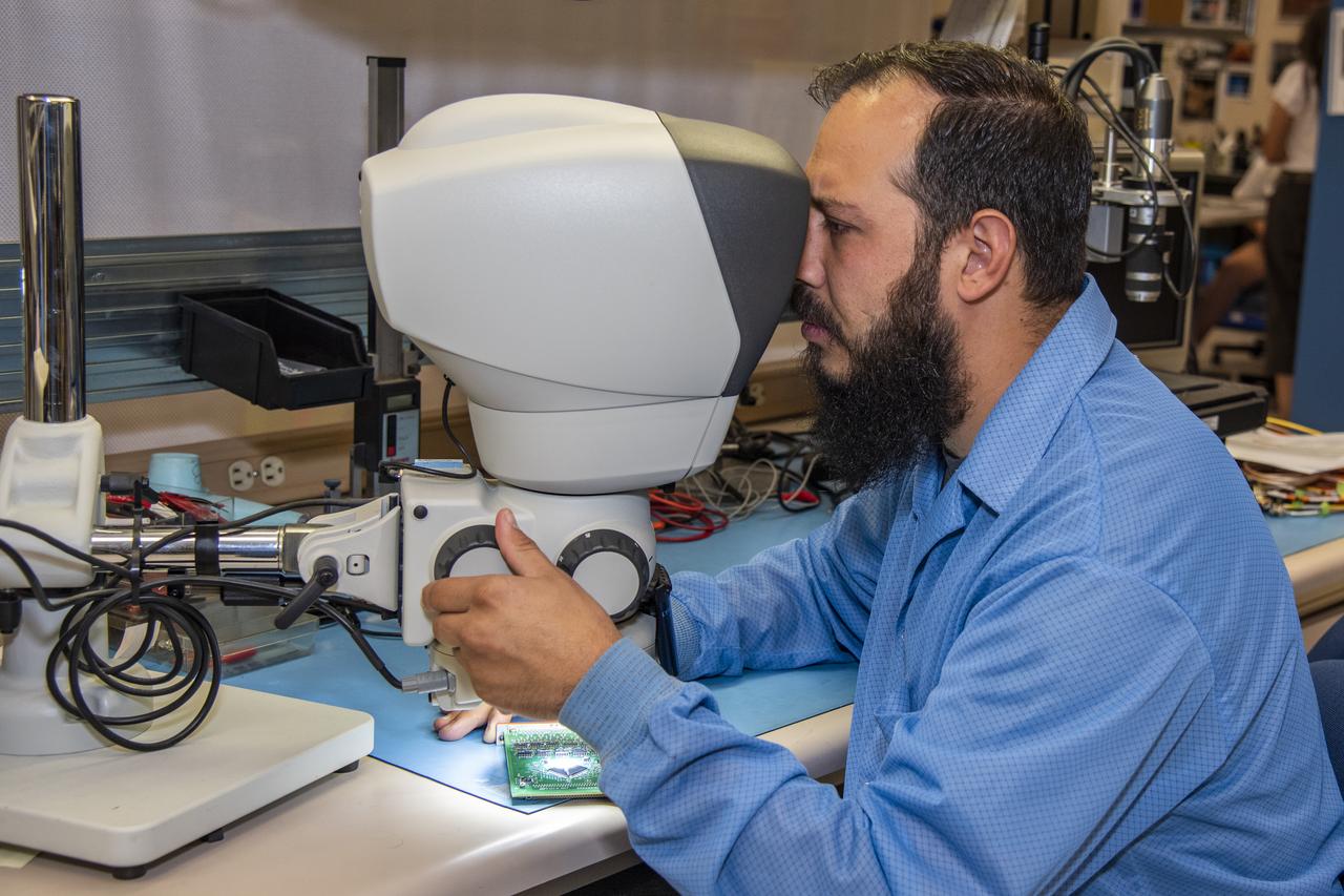 Clark Johnson inspects components tested in the Environmental Laboratory at NASA’s Armstrong Flight Research Center in California. He ensures none of the research items were damaged during testing and a check to see that the workmanship standards for the components are met.