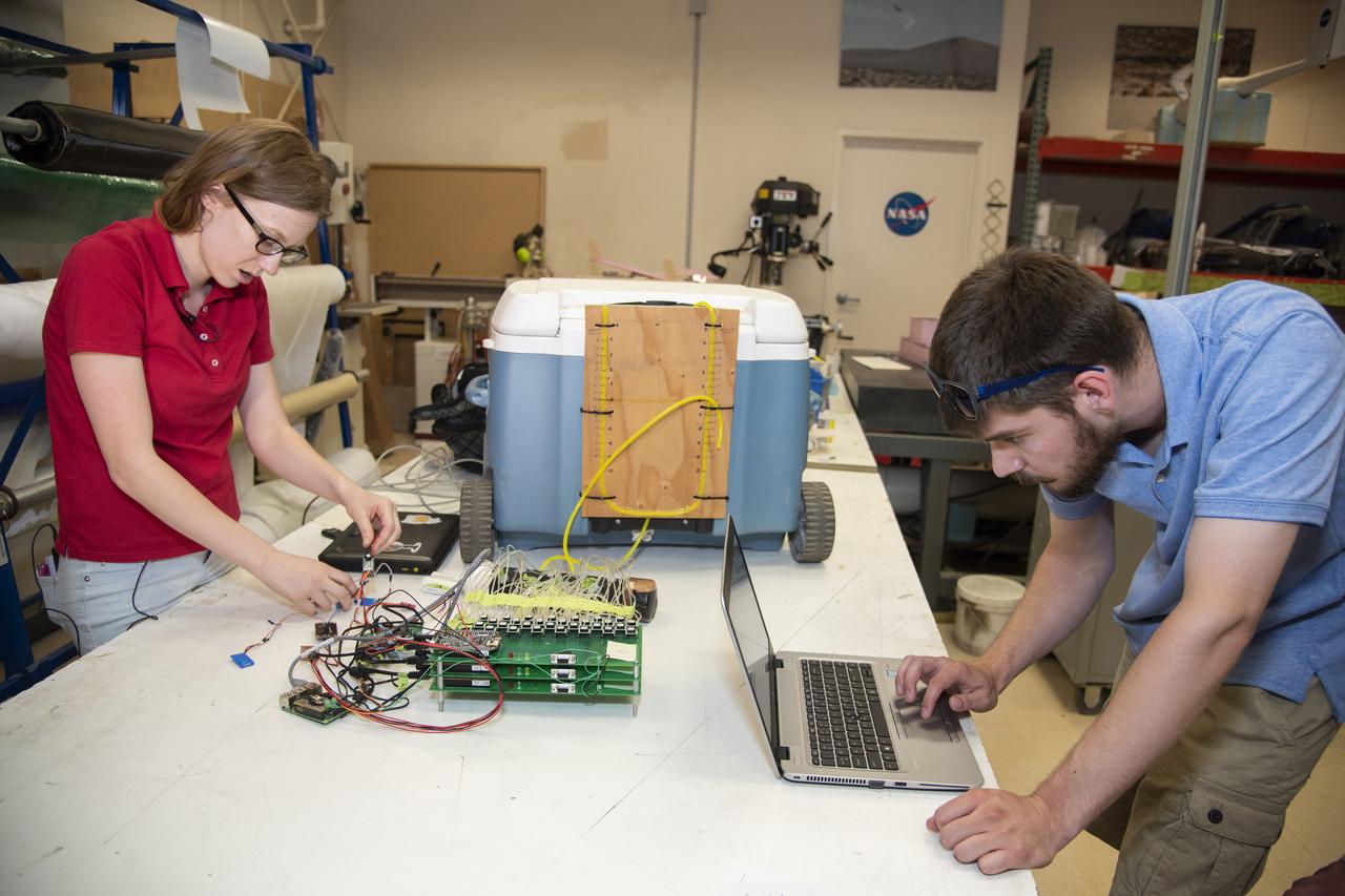 Abbigail Waddell and Nathaniel Boisjolie-Gair test a pressure system they and other students developed for the subscale Prandtl-D 3C glider.