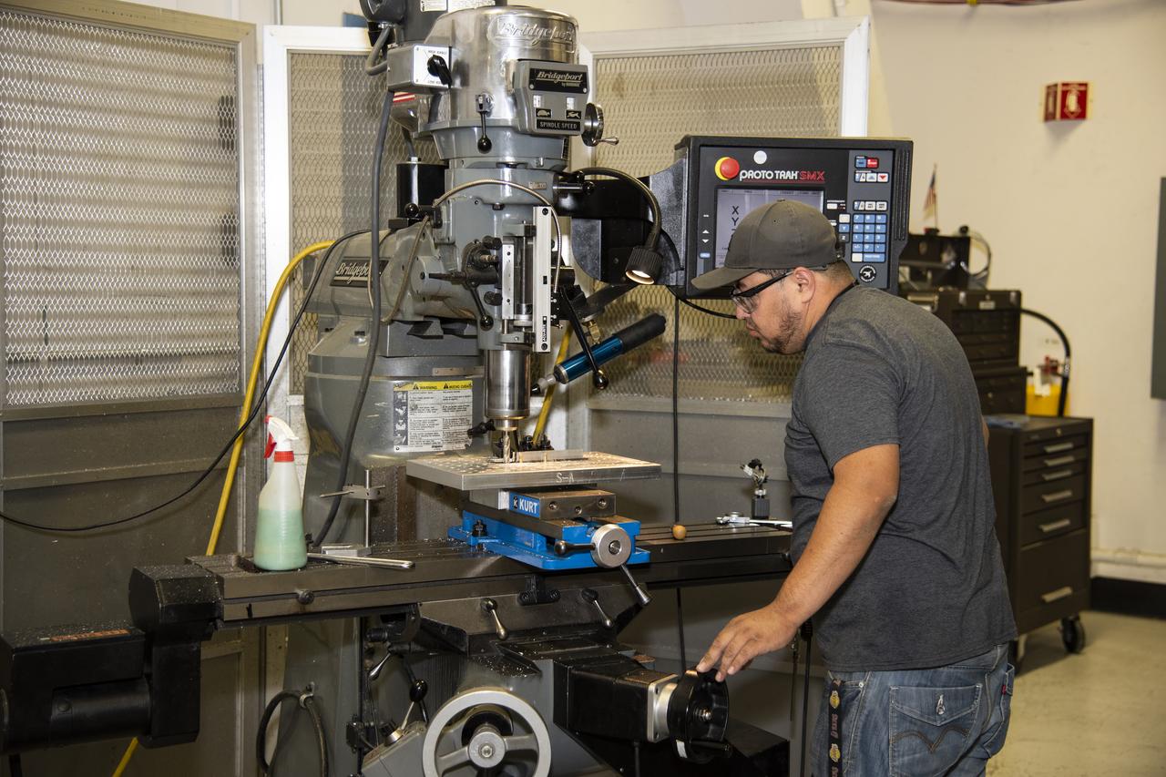 Herman Escobar works on a part for the ER-2 instrument panel.