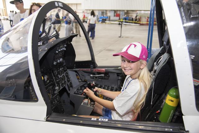 NASA image: Student Sits in Aircraft Cockpit Before the Space Station Downlink at NASA Armstrong