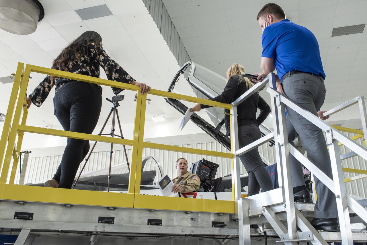 NASA Administrator Bridenstine, former navy pilot, sits comfortably back in F-18 jet cockpit at Armstrong Flight Research Center.