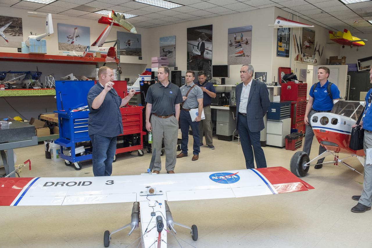 Armstrong's Robert "Red" Jensen talks to Bridenstine about using small scale aircraft to test aeronautical concepts keeping cost of aviation discoveries lower until technology is proved for larger aircraft.