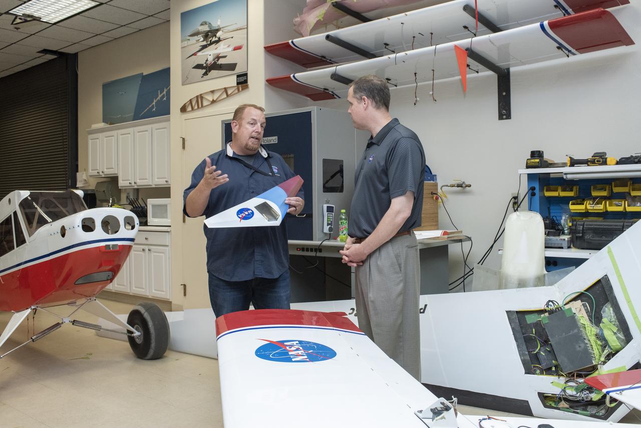 Armstrong's Robert "Red" Jensen talks to Bridenstine about using small scale aircraft to test aeronautical concepts keeping cost of aviation discoveries lower until technology is proved for larger aircraft.