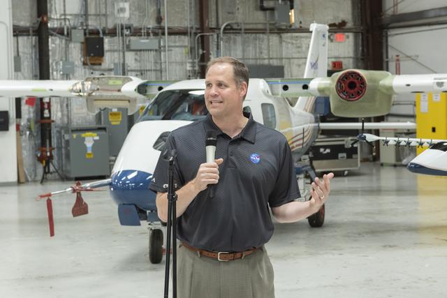 NASA Administrator Bridenstine speaks to press in front of X-57 all electric aircraft that is being modified at Scaled Composites at Mojave Air & Space Port in California