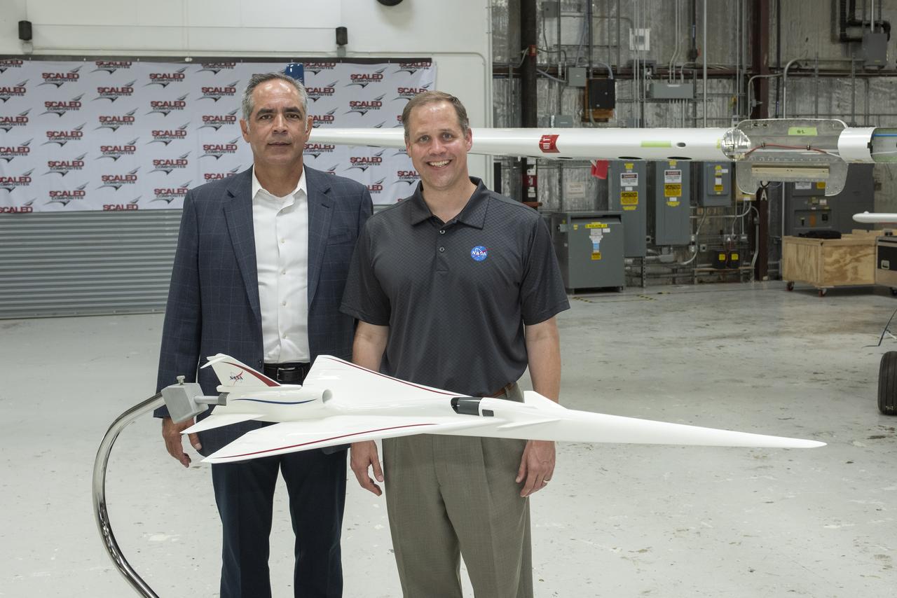 NASA Administrator Bridenstine stands with AFRC center director McBride by model NASA's Supersonic X-Plane, X-59 Quiet Supersonic Technology or QueSST. Bridenstine spoke at press event at Mojave Air and Space Port in California. The goal of X-59 is to quiet the sound when aircraft pierce the speed of sound and make a loud sonic boom on the ground.