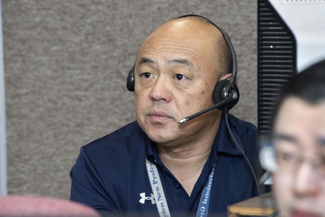 Cheng Moua, X-56A project manager, prepares for an X-56A mission in the control room.