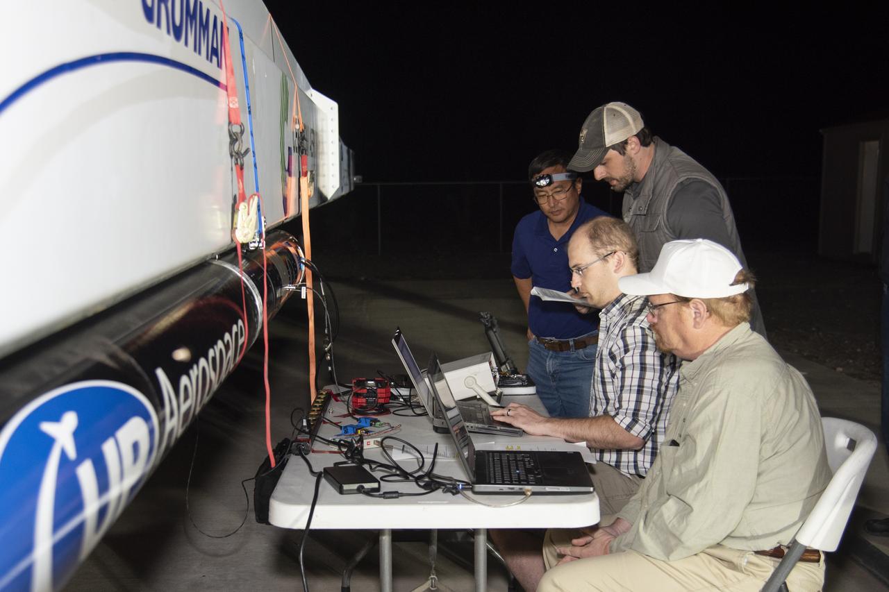 UP Aerospace employees preparing their SpaceLoft rocket to carry NASA technologies for testing in microgravity.