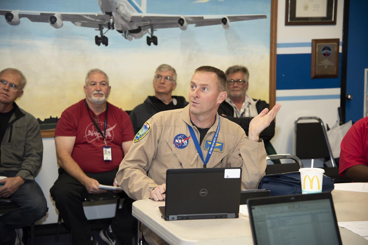 NASA pilots, engineers, and communications specialists brief the day’s operations prior to a supersonic research flight for QSF18, taking off from Ellington Field in Houston, Texas. The flights are meant to validate NASA’s techniques and technology for gather community feedback data for X-59’s Low-Boom Flight Demonstration mission.