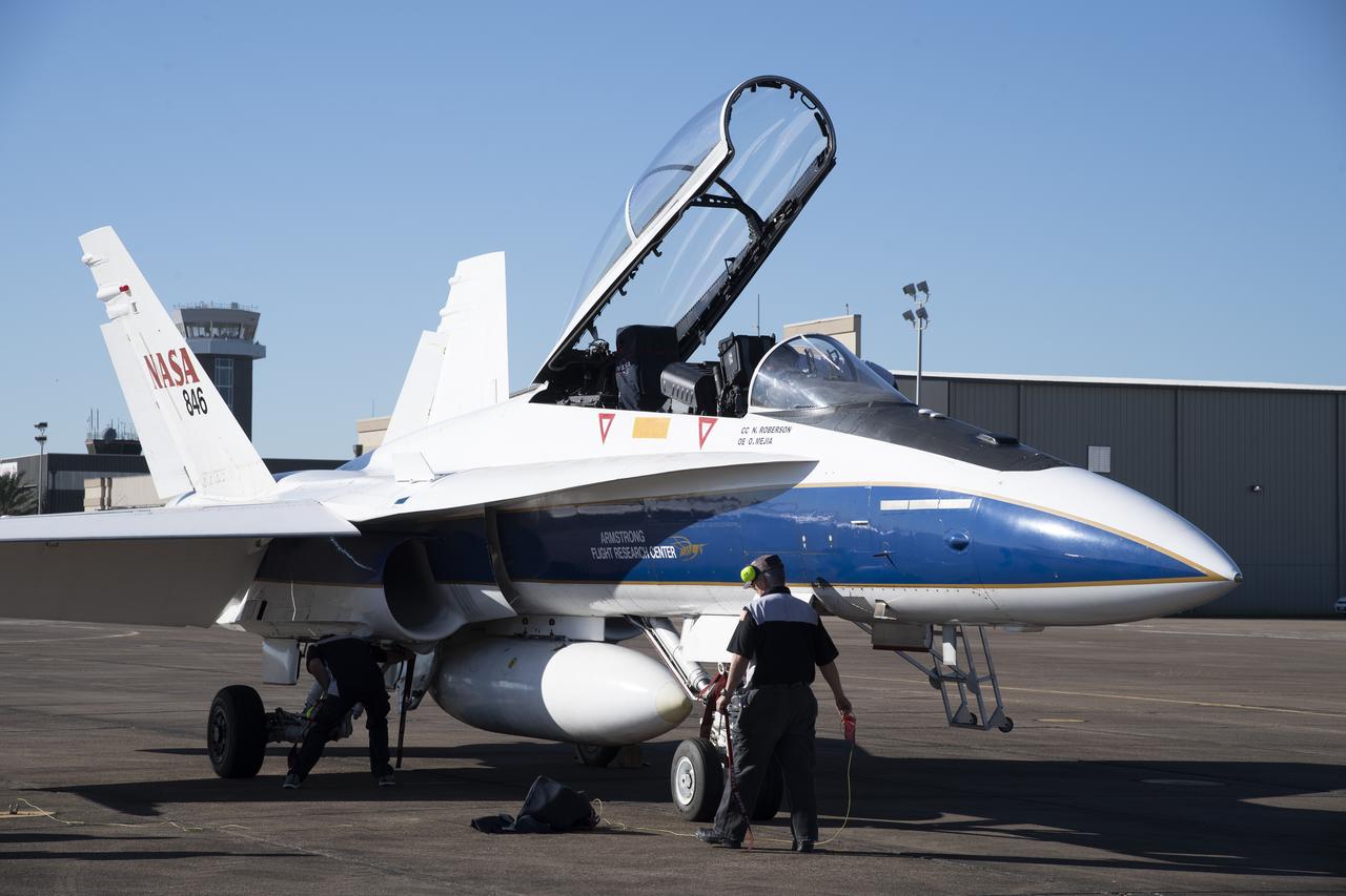NASA’s F/A-18 research aircraft stands ready prior to a QSF18 supersonic research flight off the coast of Galveston, Texas.