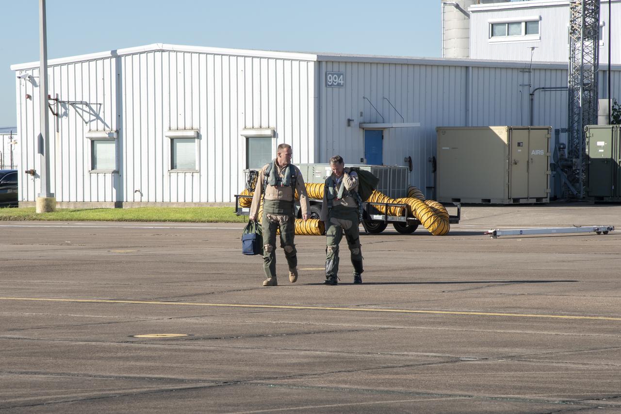 NASA test pilots Jim “Clue” Less and Wayne “Ringo” Ringelberg step to the F/A-18 research aircraft at Ellington Field and conduct pre-flight safety checks on the aircraft prior to a supersonic research flight for the QSF18 series.