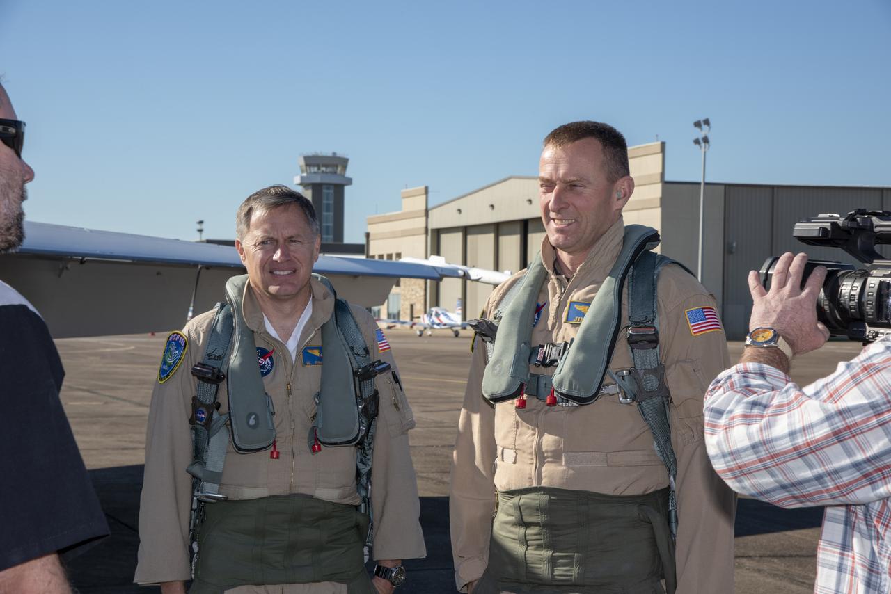 NASA test pilots Jim “Clue” Less and Wayne “Ringo” Ringelberg step to the F/A-18 research aircraft at Ellington Field and conduct pre-flight safety checks on the aircraft prior to a supersonic research flight for the QSF18 series.