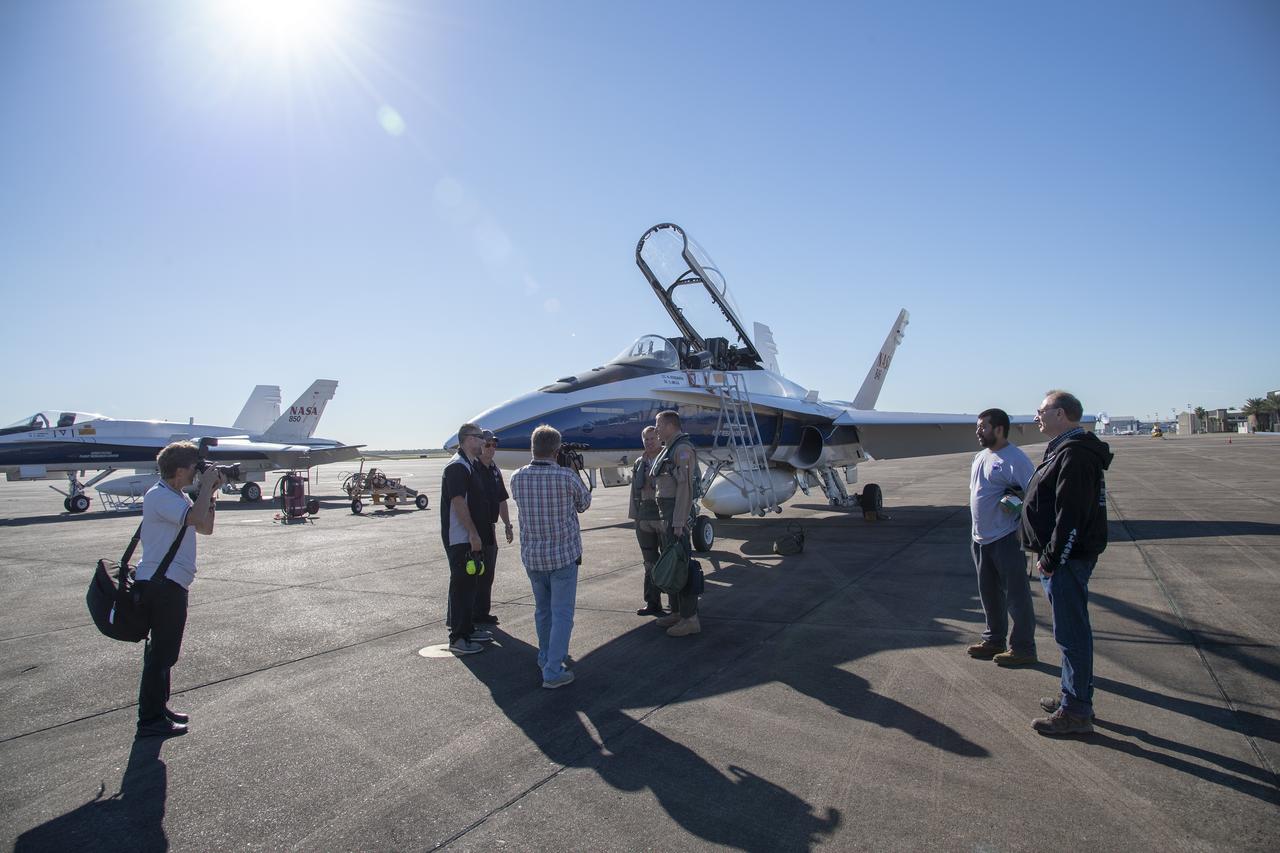 NASA test pilots Jim "Clue" Less and Wayne "Ringo" Ringelberg step to the F/A-18 research aircraft at Ellington Field and conduct pre-flight safety checks on the aircraft prior to a supersonic research flight for the QSF18 series.
