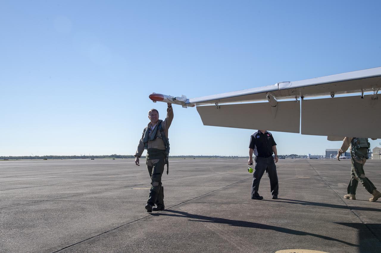 NASA test pilots Jim “Clue” Less and Wayne “Ringo” Ringelberg step to the F/A-18 research aircraft at Ellington Field and conduct pre-flight safety checks on the aircraft prior to a supersonic research flight for the QSF18 series.