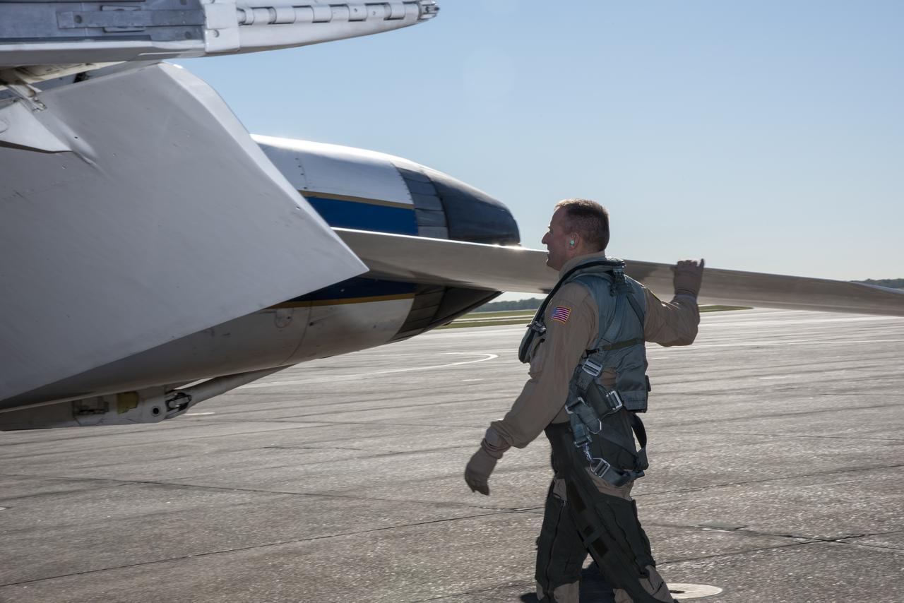 NASA test pilots Jim “Clue” Less and Wayne “Ringo” Ringelberg step to the F/A-18 research aircraft at Ellington Field and conduct pre-flight safety checks on the aircraft prior to a supersonic research flight for the QSF18 series.