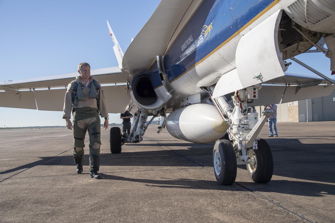NASA test pilots Jim "Clue" Less and Wayne "Ringo" Ringelberg step to the F/A-18 research aircraft at Ellington Field and conduct pre-flight safety checks on the aircraft prior to a supersonic research flight for the QSF18 series.