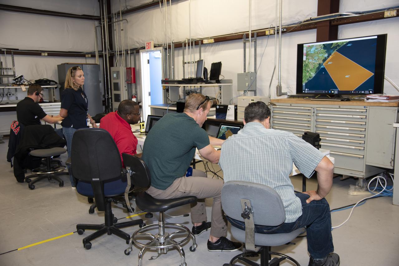 NASA mission controllers, engineers, pilots and communications specialists in the mission control room monitor the supersonic research flight off the coast of Galveston, as part of the QSF18 flight series. The flight operations crew tracks the status of the flights, maintains communications with the aircraft, communicates with U.S. Coast Guard, and coordinates community feedback data.